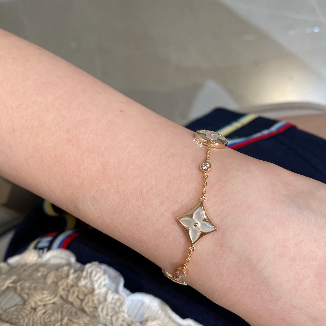 [CLOVER JEWELRY]STAR AND SUN 4 MOTIF WHITE MOP PINK GOLD BRACELET